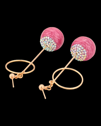 Boucles d’oreilles dorées pierres roses pendantes